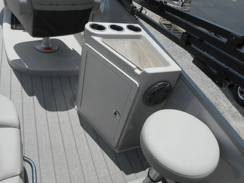Slide: The Image of 2024 Starcraft CX 25 DL BAR boat interior with seating and storage. - 5