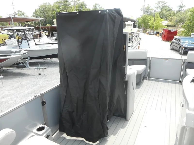 Slide: The Image of 2024 Starcraft CX 25 DL BAR boat interior with privacy curtain. - 8