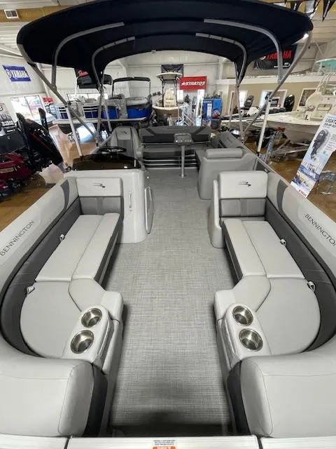 Slide: The Image of 2024 Bennington 21SXSB pontoon boat interior with spacious seating and cup holders. - 3