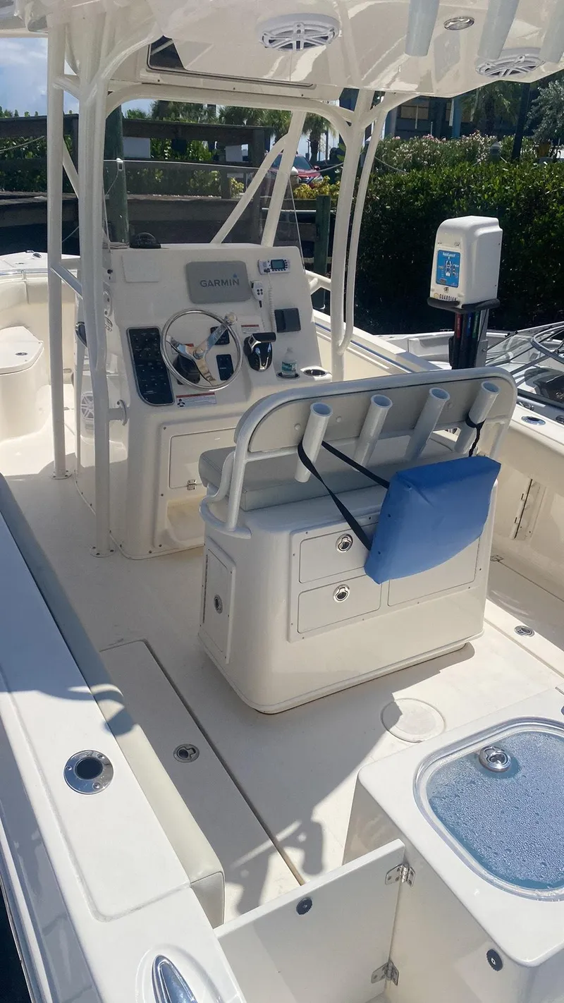 Slide: The Image of 2023 Cobia 237 Center Console boat interior with helm and seating. - 5