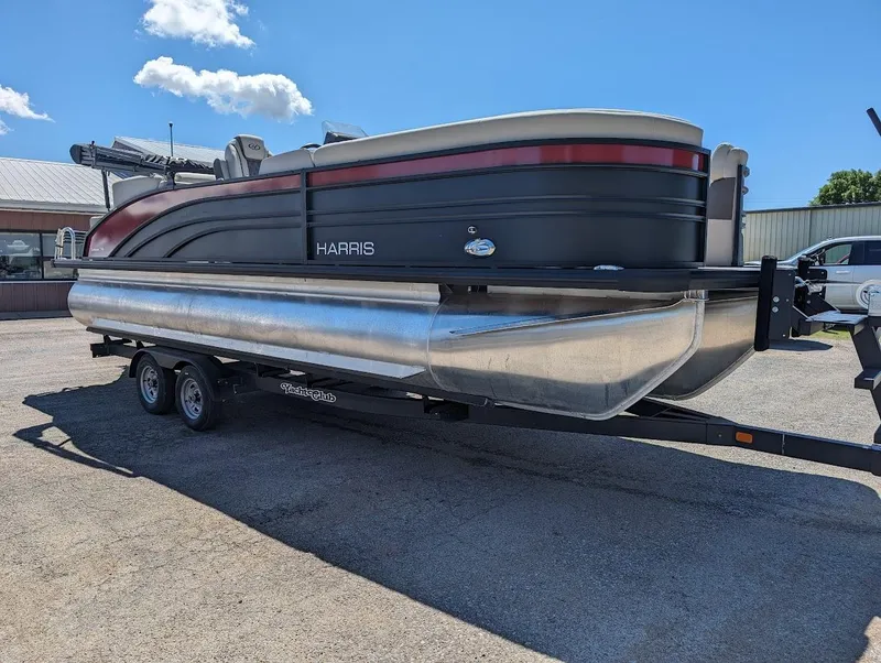 Slide: The Image of 2024 Harris FloteBote Sunliner 230 CWDH pontoon boat on a trailer. - 3