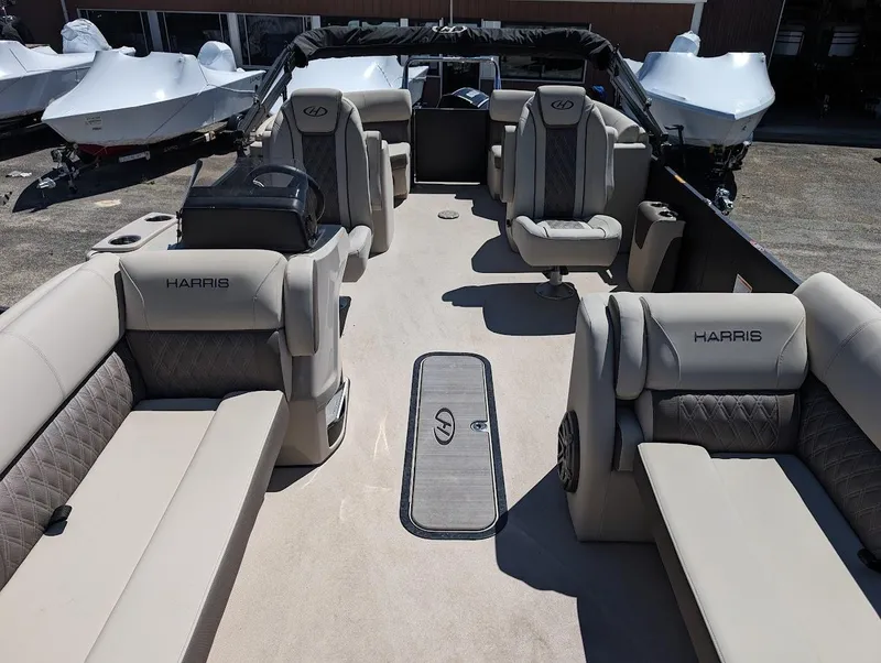 Slide: The Image of 2024 Harris FloteBote Sunliner 230 CWDH pontoon boat interior with luxurious seating. - 6