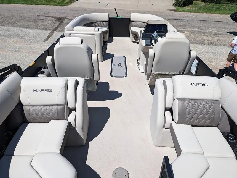 Slide: The Image of 2024 Harris FloteBote Sunliner 230 CWDH pontoon boat with luxurious seating and spacious layout. - 7