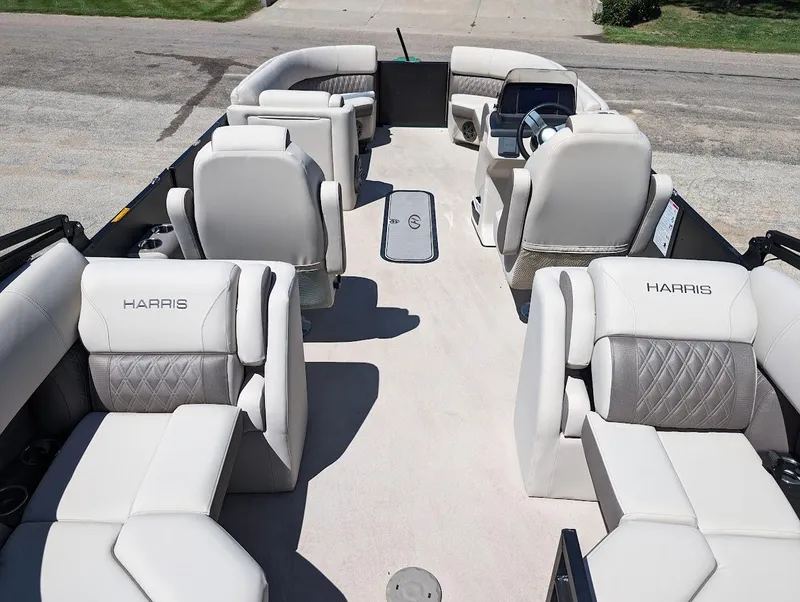 Slide: The Image of 2024 Harris FloteBote Sunliner 230 CWDH pontoon boat interior with luxurious seating. - 8