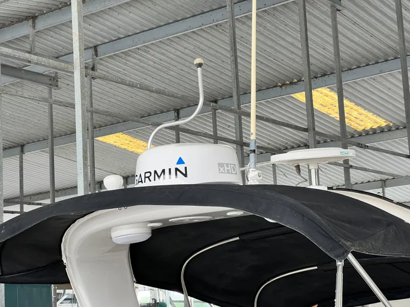 Slide: The Image of 2007 Four Winns 358 Vista boat with Garmin xHD radar under a metal roof. - 15