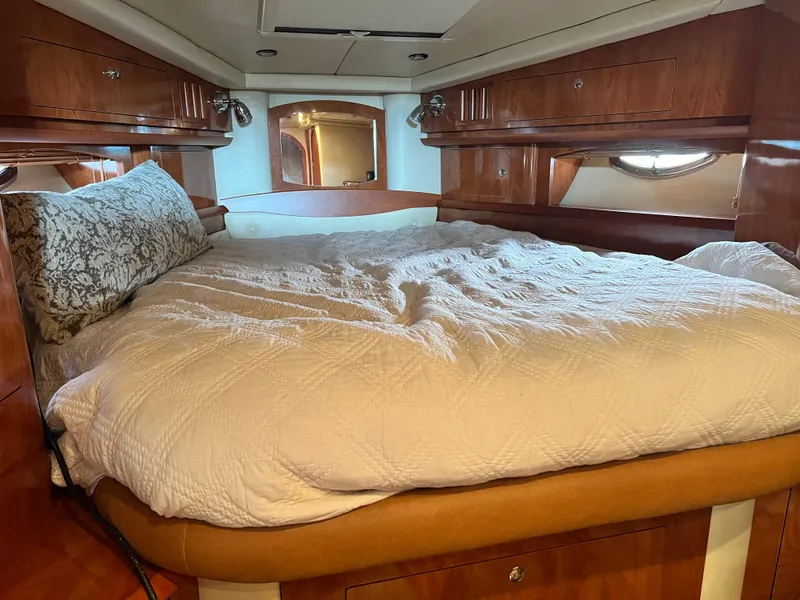 Slide: The Image of Luxurious cabin interior of 2007 Four Winns 358 Vista yacht with cozy bedding. - 21