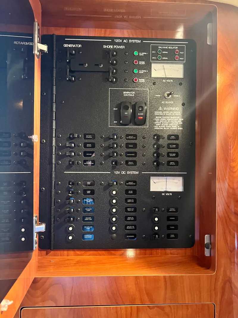 Slide: The Image of Electrical panel of 2007 Four Winns 358 Vista boat, featuring AC and DC systems. - 23