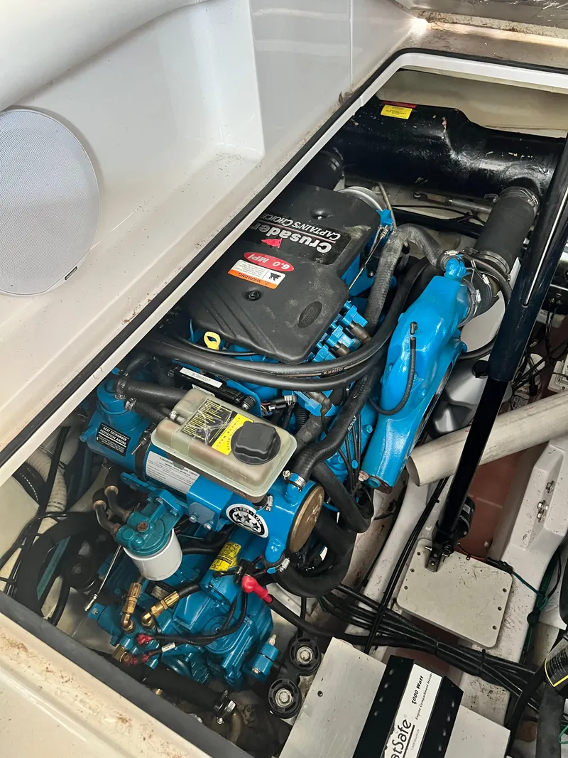 Slide: The Image of Engine compartment of 2007 Four Winns 358 Vista boat, featuring Crusader engine. - 26