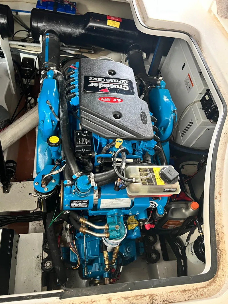 Slide: The Image of Engine compartment of a 2007 Four Winns 358 Vista boat, featuring a Crusader 6.0 MPI engine. - 27