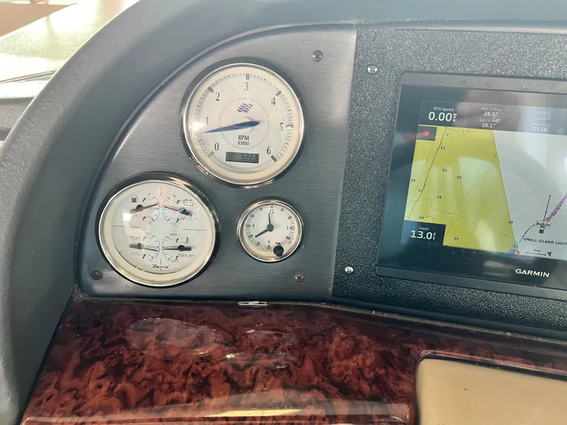 Slide: The Image of 2007 Four Winns 358 Vista dashboard with gauges and Garmin navigation system. - 10