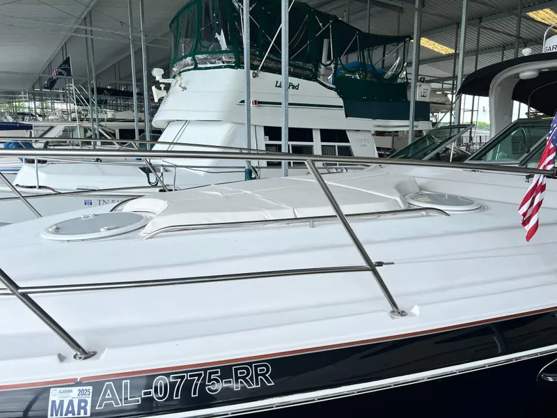 Slide: The Image of 2007 Four Winns 358 Vista boat docked in a marina with registration number AL-0775-RR. - 15