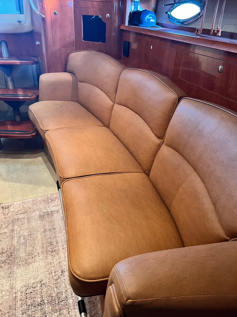 Slide: The Image of Luxurious interior of a 2007 Four Winns 358 Vista yacht with a comfortable leather sofa. - 17