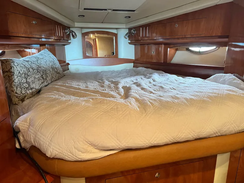Slide: The Image of Luxurious bedroom interior of 2007 Four Winns 358 Vista yacht with cozy bedding. - 22