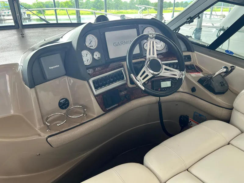 Slide: The Image of 2007 Four Winns 358 Vista boat helm with Garmin navigation system and leather seating. - 3
