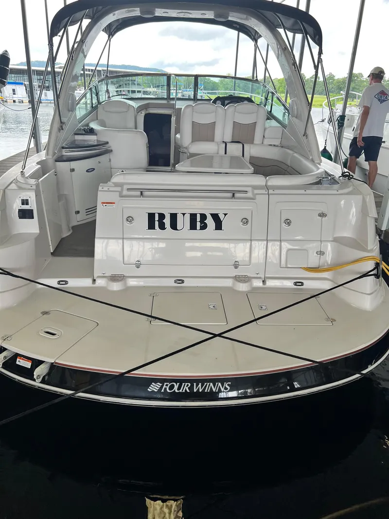 Slide: The Image of 2007 Four Winns 358 Vista boat named RUBY docked at a marina. - 8