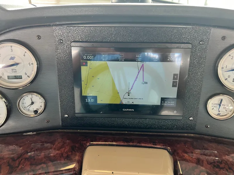 Slide: The Image of 2007 Four Winns 358 Vista dashboard with Garmin navigation system and gauges. - 9