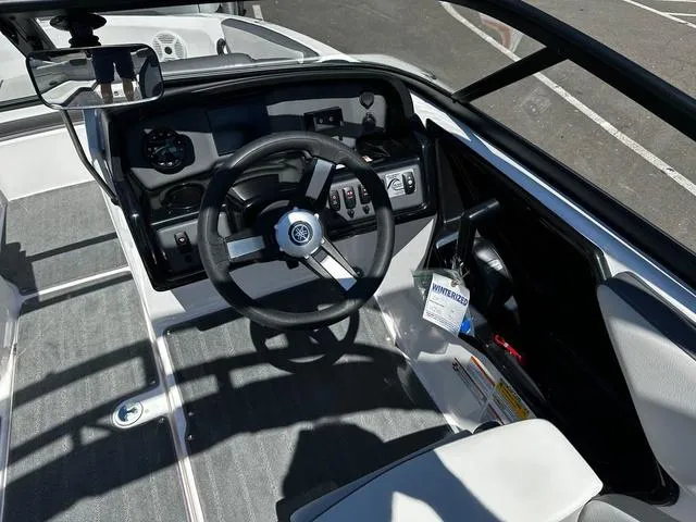 Slide: The Image of 2023 Yamaha Boats AR190 cockpit with steering wheel and control panel. - 6