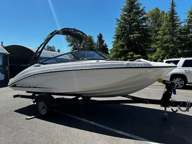 Slide: The Image of 2023 Yamaha Boats AR190 on trailer in parking lot, ready for adventure. - 8