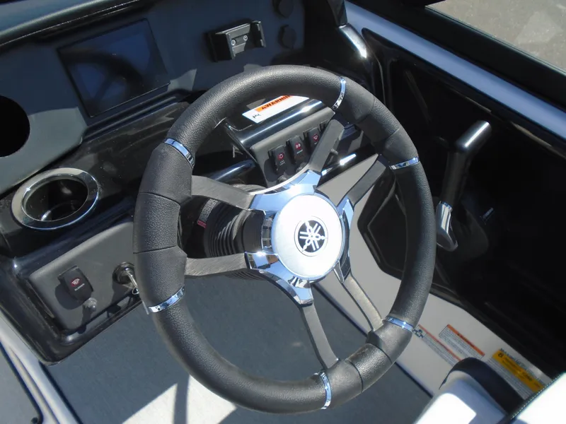 Slide: The Image of 2024 Yamaha Boats SX195 steering wheel and dashboard close-up. - 10