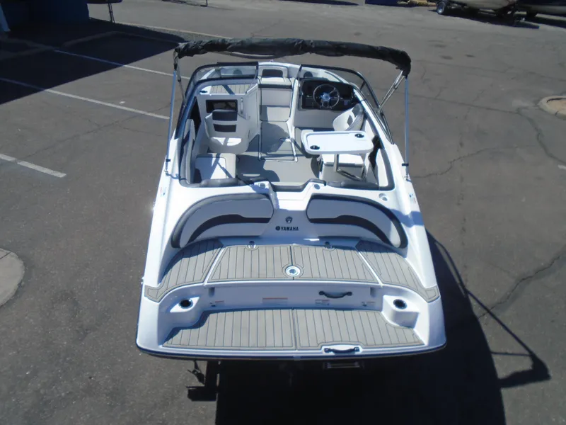 Slide: The Image of 2024 Yamaha Boats SX195, sleek design, spacious interior, rear view. - 16