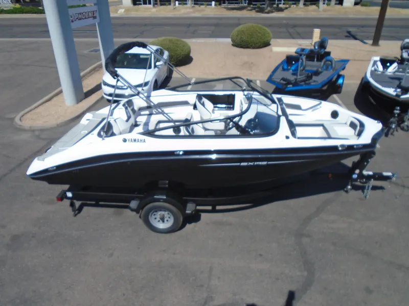 Slide: The Image of 2024 Yamaha Boats SX195 on trailer, sleek design, parked outdoors. - 7