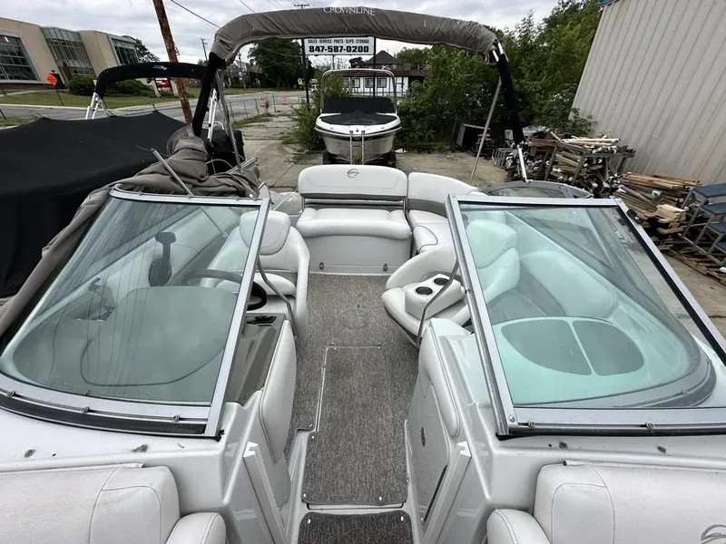 Slide: The Image of 2012 Crownline E1 boat interior with open bow seating and windshield. - 11