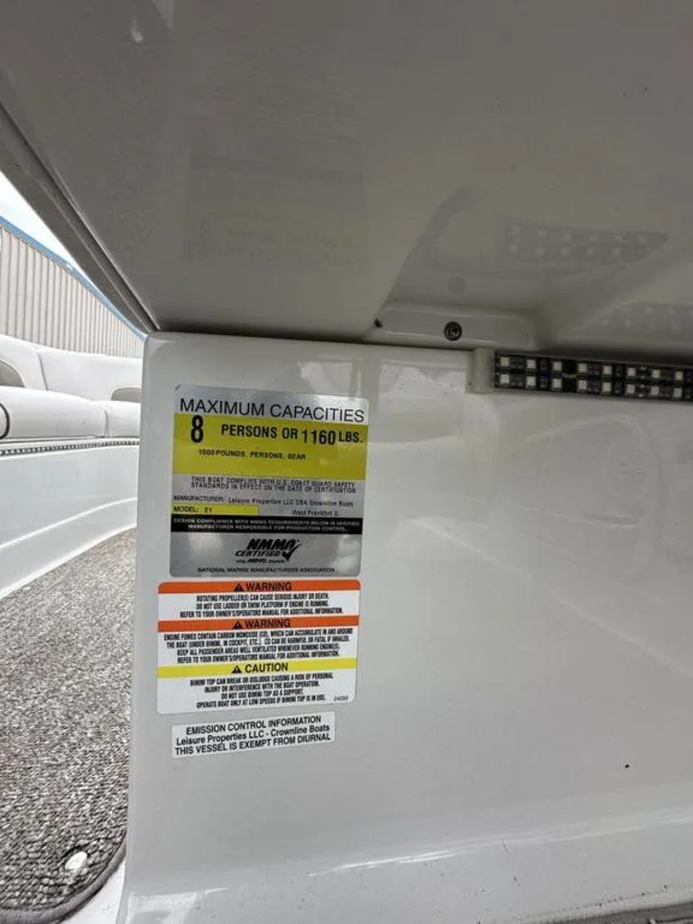 Slide: The Image of 2012 Crownline E1 boat capacity label, maximum 8 persons or 1160 lbs. - 13