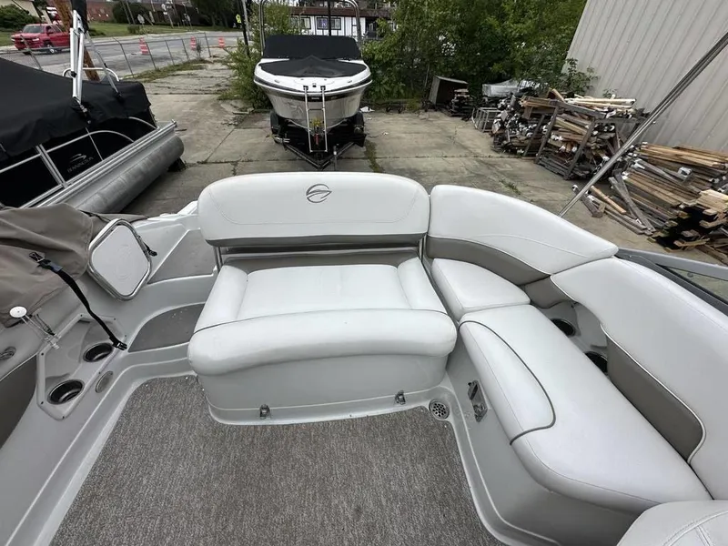 Slide: The Image of 2012 Crownline E1 boat interior with white and gray seating. - 15