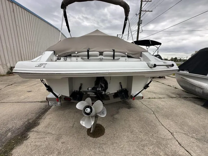 Slide: The Image of 2012 Crownline E1 boat rear view with covered deck and propeller. - 18