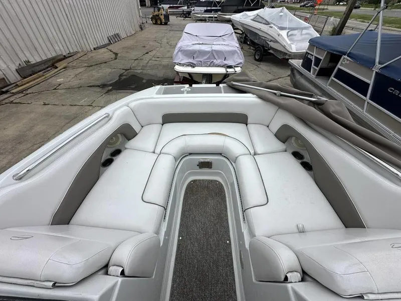 Slide: The Image of 2012 Crownline E1 boat interior with white seating and cup holders. - 5