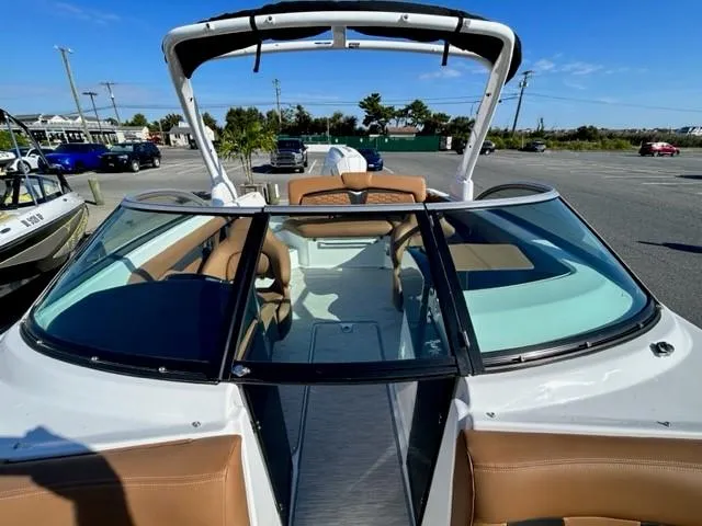 Slide: The Image of 2024 Four Winns HD3 OB boat with tan seats and open bow design. - 12