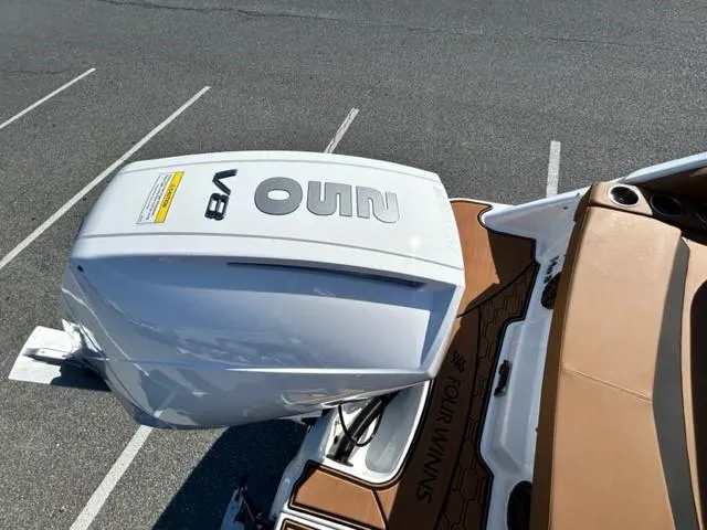 Slide: The Image of 2024 Four Winns HD3 OB boat with a powerful V8 outboard engine. - 16