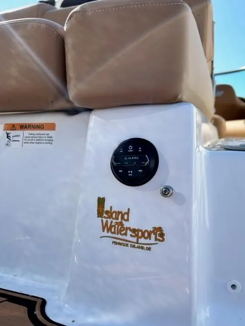 Slide: The Image of 2024 Four Winns HD3 OB boat with Island Watersports branding. - 19