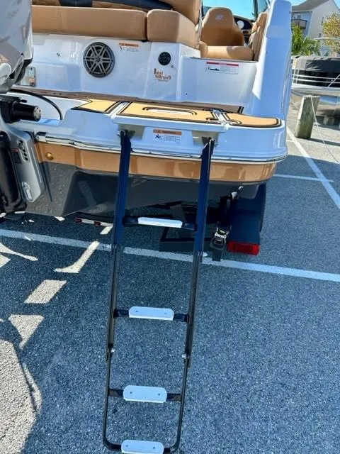 Slide: The Image of 2024 Four Winns HD3 OB boat with extended swim platform and ladder. - 20