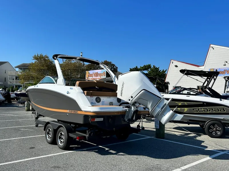Slide: The Image of 2024 Four Winns HD3 OB boat on trailer in parking lot. - 27