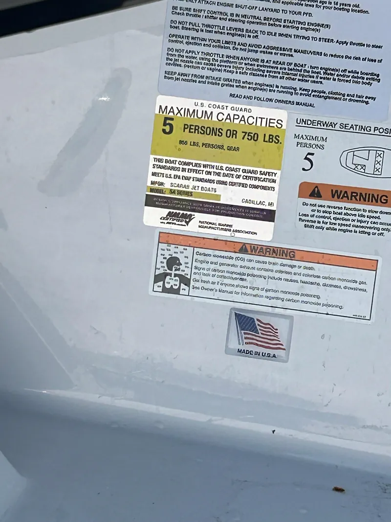 Slide: The Image of 2023 Scarab 165ID boat capacity and safety warning labels - 13