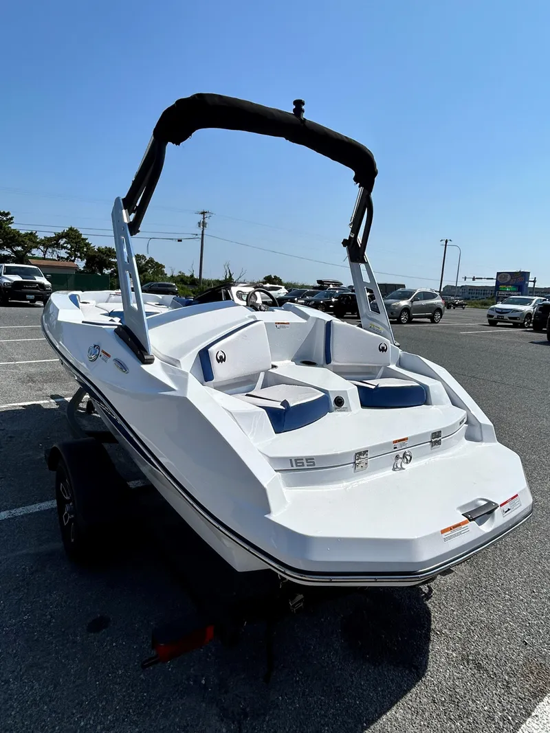 Slide: The Image of 2023 Scarab 165ID boat in a parking lot, rear view. - 4