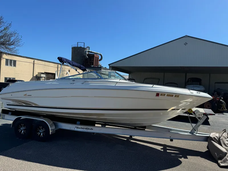Slide: The Image of 1996 Sea Ray 260 Bow Rider boat on trailer, parked outdoors. - 5