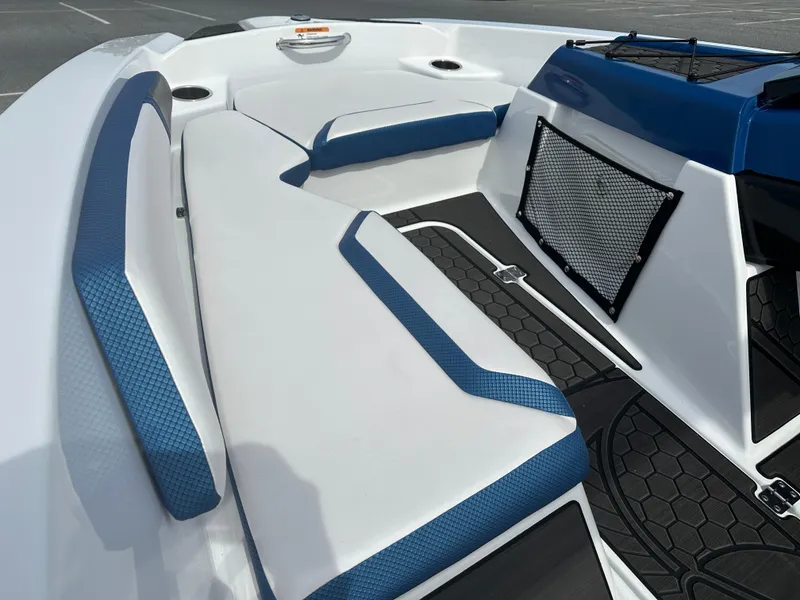 Slide: The Image of 2023 Scarab 165ID boat interior with white and blue seating. - 14