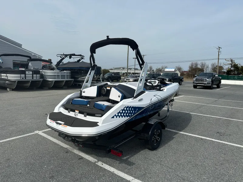 Slide: The Image of 2023 Scarab 165ID boat in parking lot, rear view. - 8