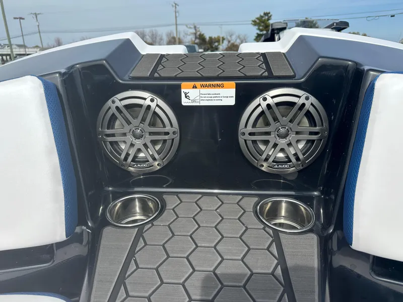 Slide: The Image of 2023 Scarab 165ID boat interior with speakers and cup holders. - 9