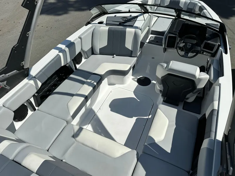 Slide: The Image of 2024 Malibu Wakesetter 21LXR interior, spacious seating, modern design, luxury wakeboarding boat. - 6