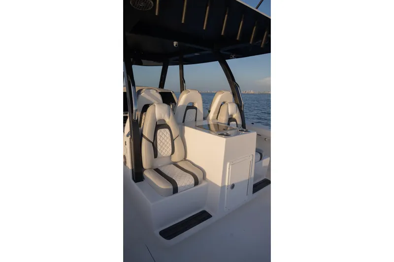 Slide: The Image of Luxury seating on 2024 Hammer Yachts 35, featuring sleek design and ocean backdrop. - 10