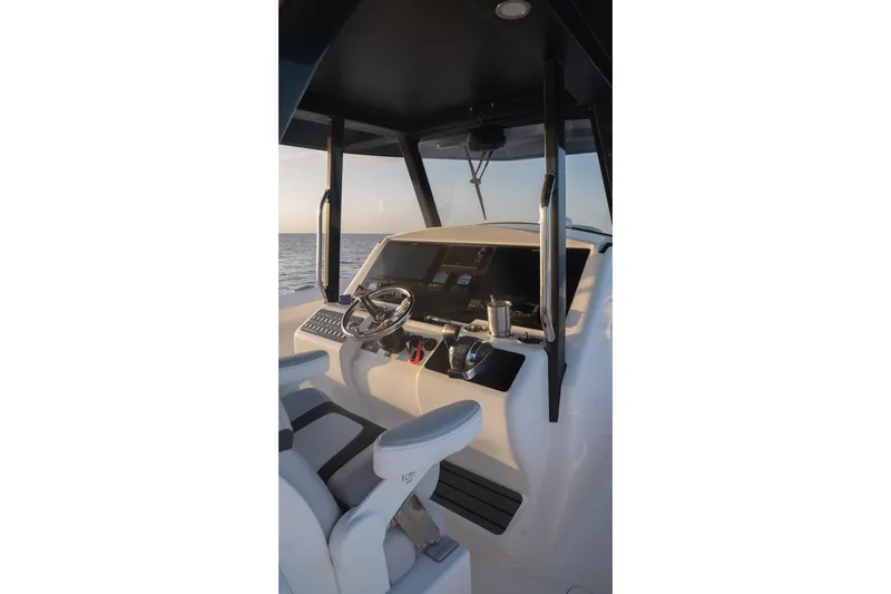 Slide: The Image of Helm of 2024 Hammer Yachts 35, featuring modern controls and ocean view. - 11