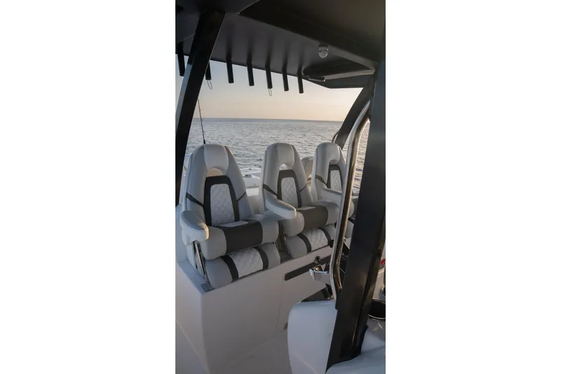 Slide: The Image of Luxury seating on 2024 Hammer Yachts 35, overlooking serene ocean view. - 12