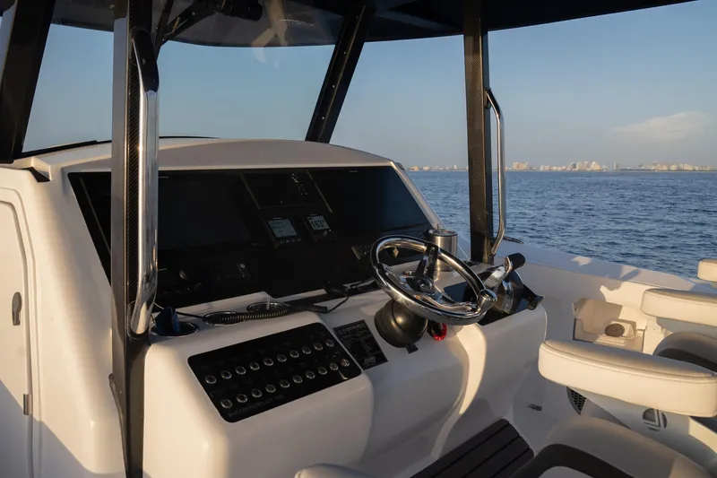 Slide: The Image of Helm of 2024 Hammer Yachts 35, featuring modern controls and ocean view. - 15