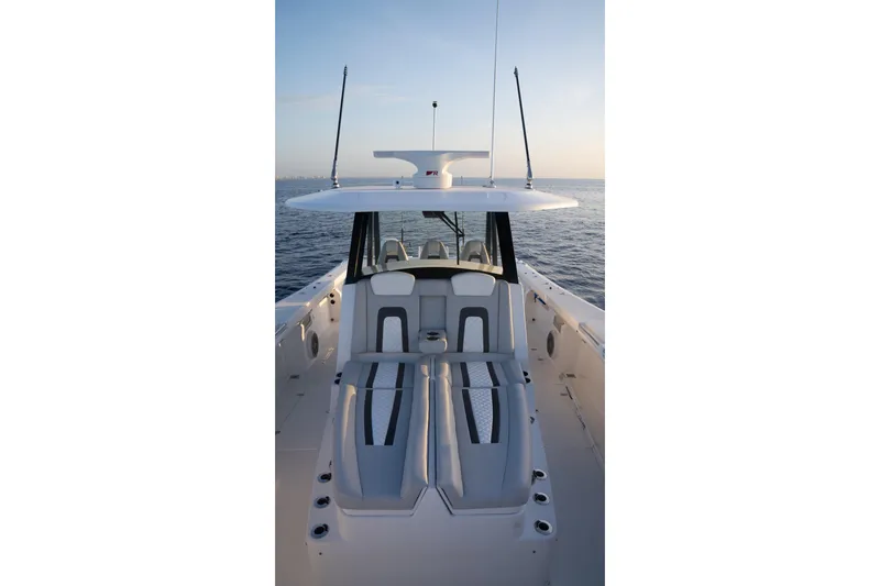 Slide: The Image of 2024 Hammer Yachts 35 model, sleek design, spacious deck, ocean backdrop. - 2