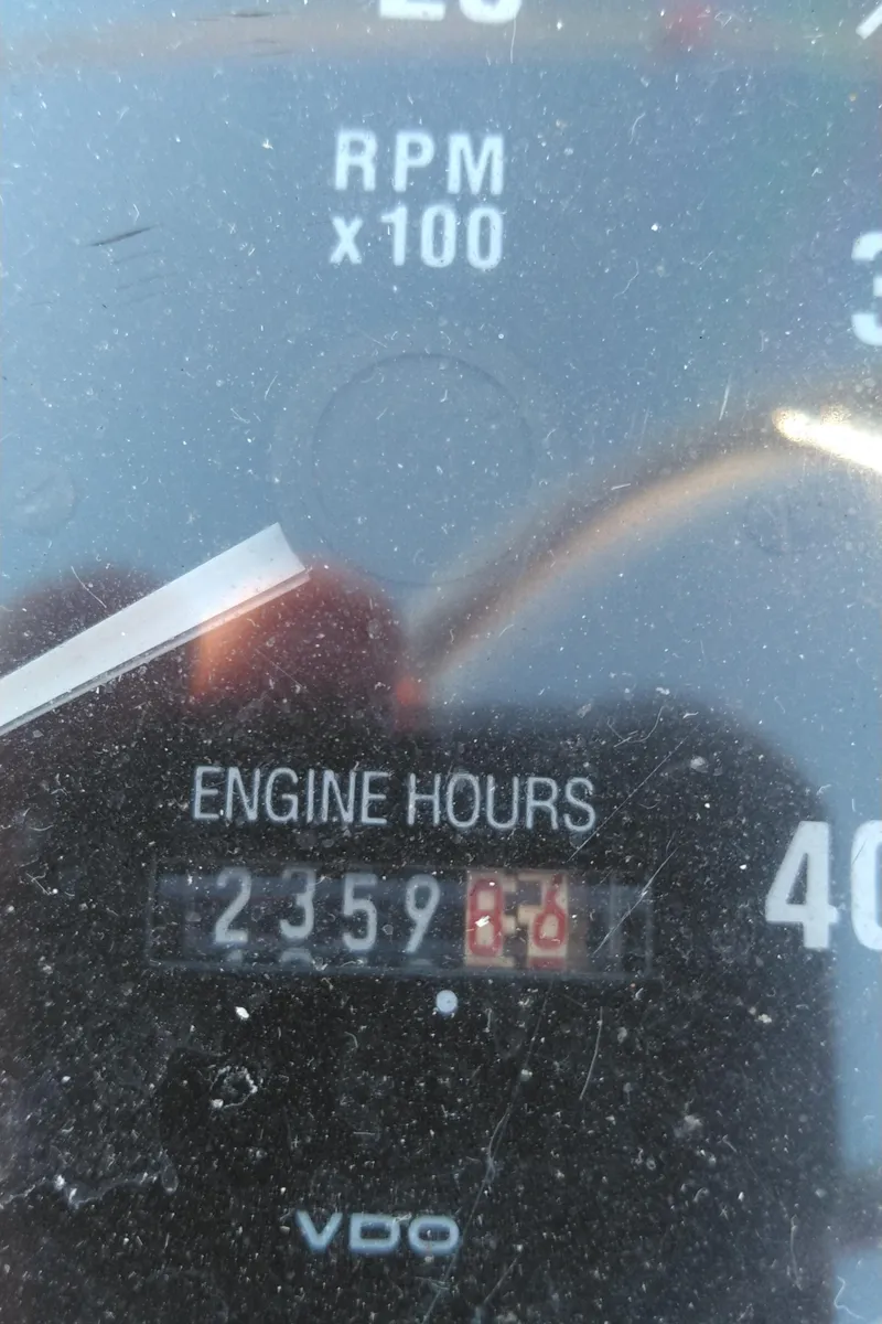 Slide: The Image of Close-up of 1999 Mainship 350 Trawler engine hours gauge showing 2359.8 hours. - 16