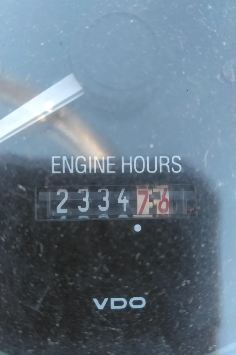 Slide: The Image of 1999 Mainship 350 Trawler engine hours meter showing 2334.7 hours. - 17