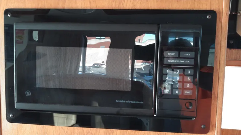 Slide: The Image of Built-in microwave in 1999 Mainship 350 Trawler kitchen. - 25